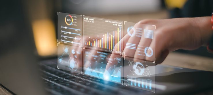 Data analyst working on business analytics dashboard with charts, metrics and KPI to analyze performance and create insight reports for operations management.